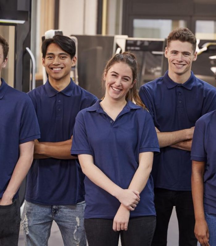 Portrait Of Engineering Apprentices In Factory